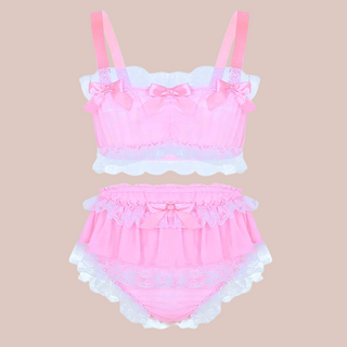 In baby pink, this bra and panties set has bandeau style bra top edged in white lace and colour matching satin bows. The panties are a high waisted design and have matching lace frills and satin bows.