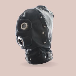 A side view of The Fetish Hood in black from House Of Chastity, it is shown here with the eye mask and gag removed, you can see the round eye holes and mouth hole.