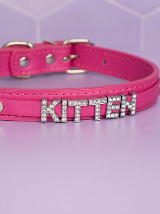 A close up of the KITTEN lettering, you can see the matching hot pink raised strap that it attached to.