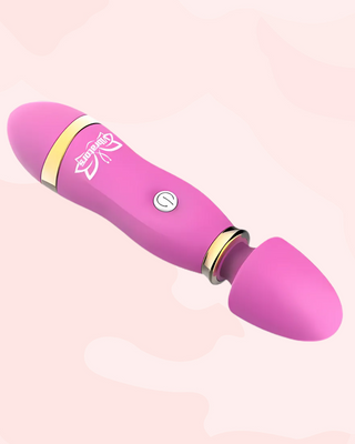 The pink Mini Cordless Magic Wand, this massager comes in a lovely pink colour with gold accents