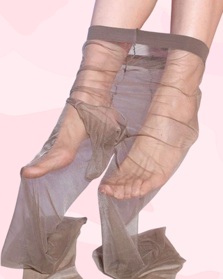 Sheer grey tights shown on a model, the penis pouch can be seen.