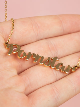 the Pornstar necklace shown hanging, you can get an idea of size due to the fingers.