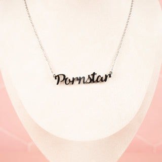 The Pornstar necklace in silver displayed on mannequin, you can see how the necklace sits on the neckline.