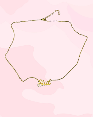 The full view of the Slut necklace, the adjustable chain length can be clearly seen.