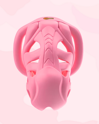 A front on view of the pink cock cage, the cut out air hole design and intricate engraving are clear to see.