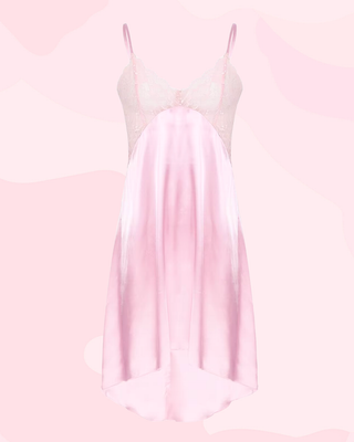 A front view of the pink Vintage style slip om a pink background