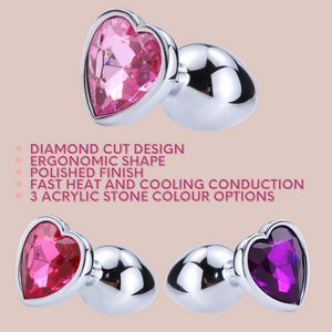 This image shows all 3 colours of the Heart Butt Plug and explains that it has a diamond cut design, ergonimic shape, polished finish, fast heat and cooling conductins, and 3 acrylic stone colour options.