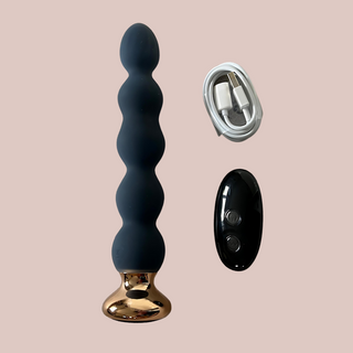 The anal  bead style vibrator shown here with the charging cable and optional controller.