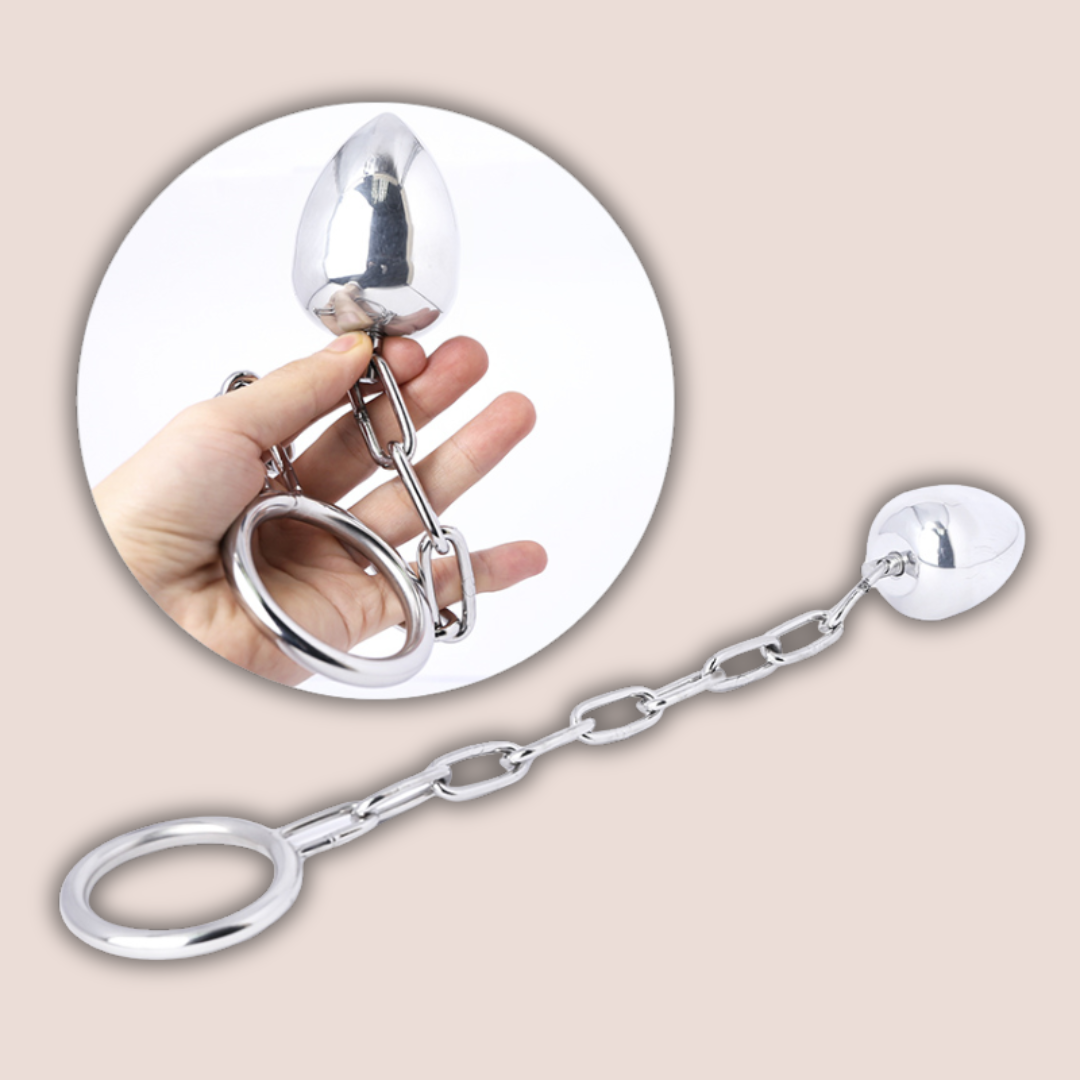 A full length image of the Anal Egg with Chained Cock Ring from House Of Chastity and a smaller image showing the product being held to give an idea of size.