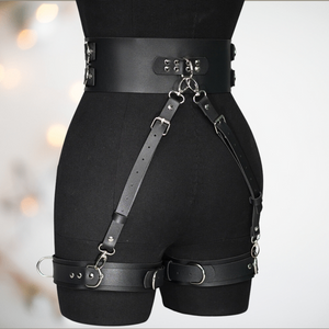 A rear view of the BDSM body harness, you can see the waist and leg straps fitted and the strapping attached.
