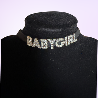 A close up of the BABY GIRL diamante lettering