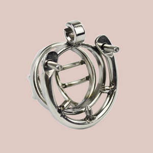 A small sized chastity cage made from stainless steel. It has a side bar design with open centre and comes with a stainless steel barbed ring. It comes in various ring sizes.