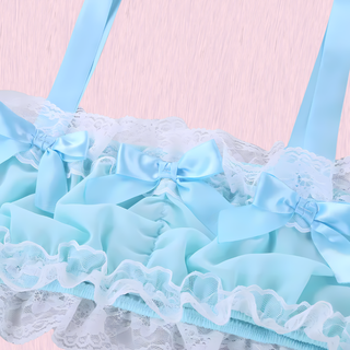 A close up of the satin ribbons, lace edging and ruched satin.