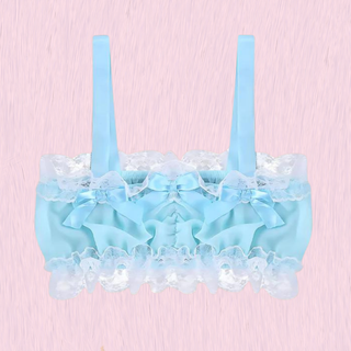 The pale blue crop top on a pink background