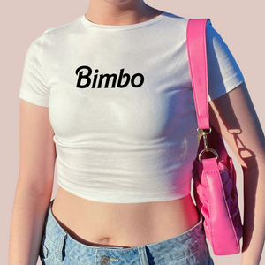 A white crop top t-shirt with Bimbo in black print across the chest.