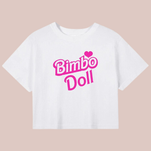 The white t-shirt style crop top from House Of Chastity, across the centre of the chest is the wording Bimbo Doll with a heart.