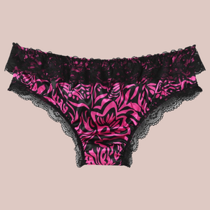 The back view of the wild pink satin bow knot panties with black lace edging.