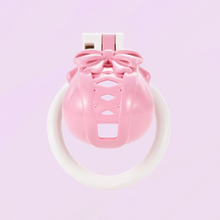 A front on view of the chastity cage shown in pink and white, the molded bow can be seen at the top of the cage.