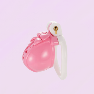 A side profile of the pink and white chastity cage shown fully assembled.