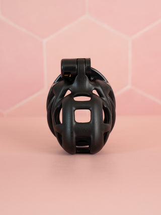 A front on view of the Cobra Double Cuff Nub, you can see the black colouring and cut out cage design to allow for air flow and urination.