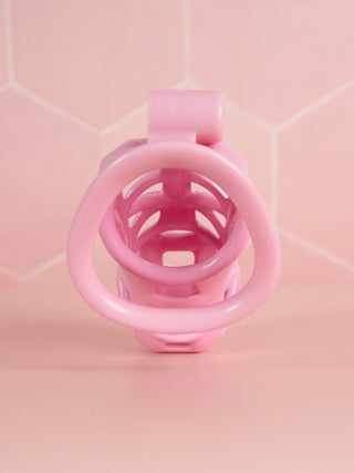 The maxi sized Cobra Double Cuff chastity device is shown from the rear, the base ring is fitted to the cage.