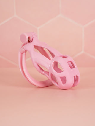 A side view of the Cobra Double Cuff chastity cage, the cage is shown fully assembled with the base ring and integral lock fixed in place.