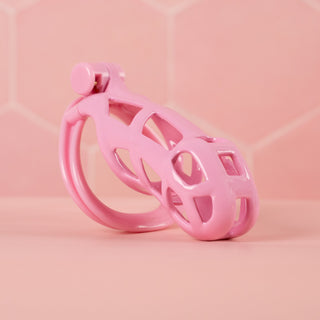 An angled view of the fully assembled Cobra Double Cuff, you can see the unique double cuff base ring. This is a standard size cage in pink.