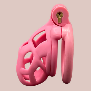 A side view of the fully assembled Cobra Flat Cuff Nano cock cage in Pink