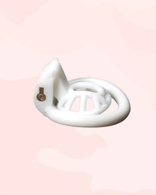The cobra Innie chastity cage lying on its back to show how shallow it is, you can see the integral lock