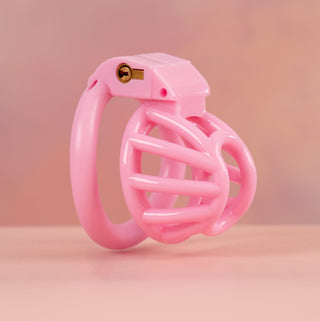 The pink Cobra Nub  shown at an angled side view, the product is fully assembled with a base ring and the integral lock fitted.