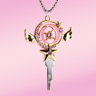 the pendant shown face on, the manga design incorporates wings, stars and diamante studs.