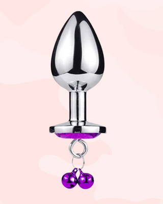 A vertical view of the purple butt plug, you can see how the removable bells will hang from the plug.