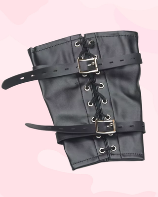 The arm binder is shown flat, the lacing and buckles are clear to see.