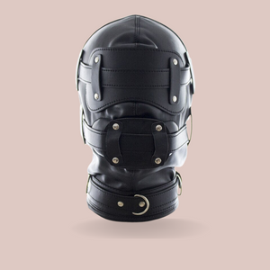 A front view of The Fetish Hood from House Of Chastity in black fully assembled with the eye mask and gag in place.
