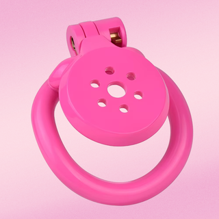 An angled view of the Flat Gatling chastity cage, the gatling cut out design to the front allows for air flow and urination.