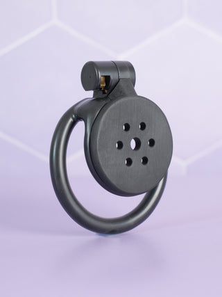 The Flat Gatling Flat Chastity Cage in the black colourway.