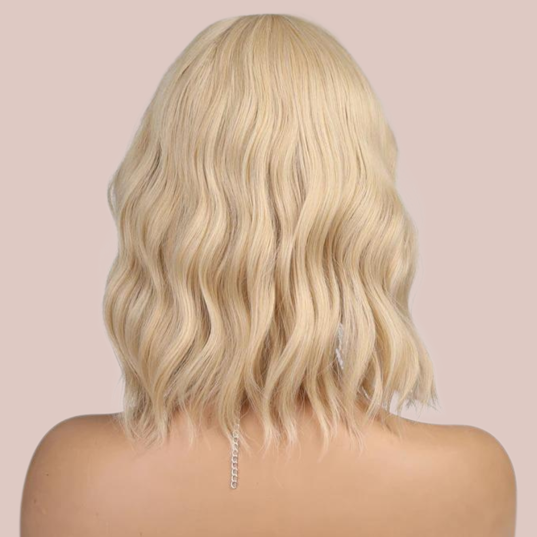The rear view of the golden blonde 16" wig from House Of Chastity shown with a styled wig.