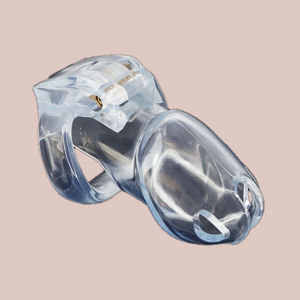 Shown is the clear standard cock cage that we offer in our version of the Holy Trainer range. It is shown from the side angle so that you have a full view of the assembled chastity cage, the cock cage is shown attached to a base ring and the integral lock is in place, showing how it fits to the body. This product is the clear version, these cages also come in pink and black.