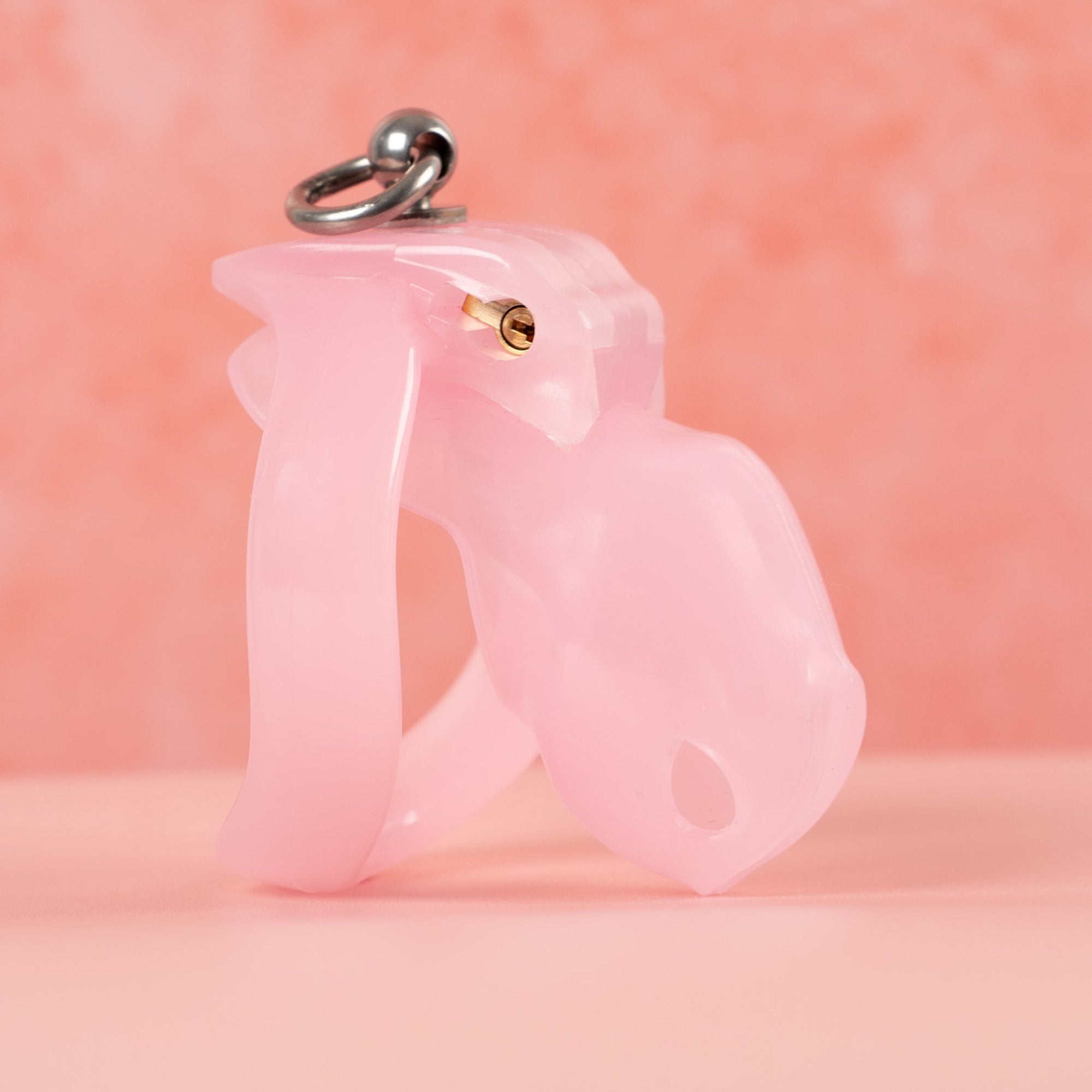 The binding loop base ring fitted to an HTV4 chastity cage. You can see the binding loop on the top of the base ring which allows the wearer to be attached to a lead and controlled.