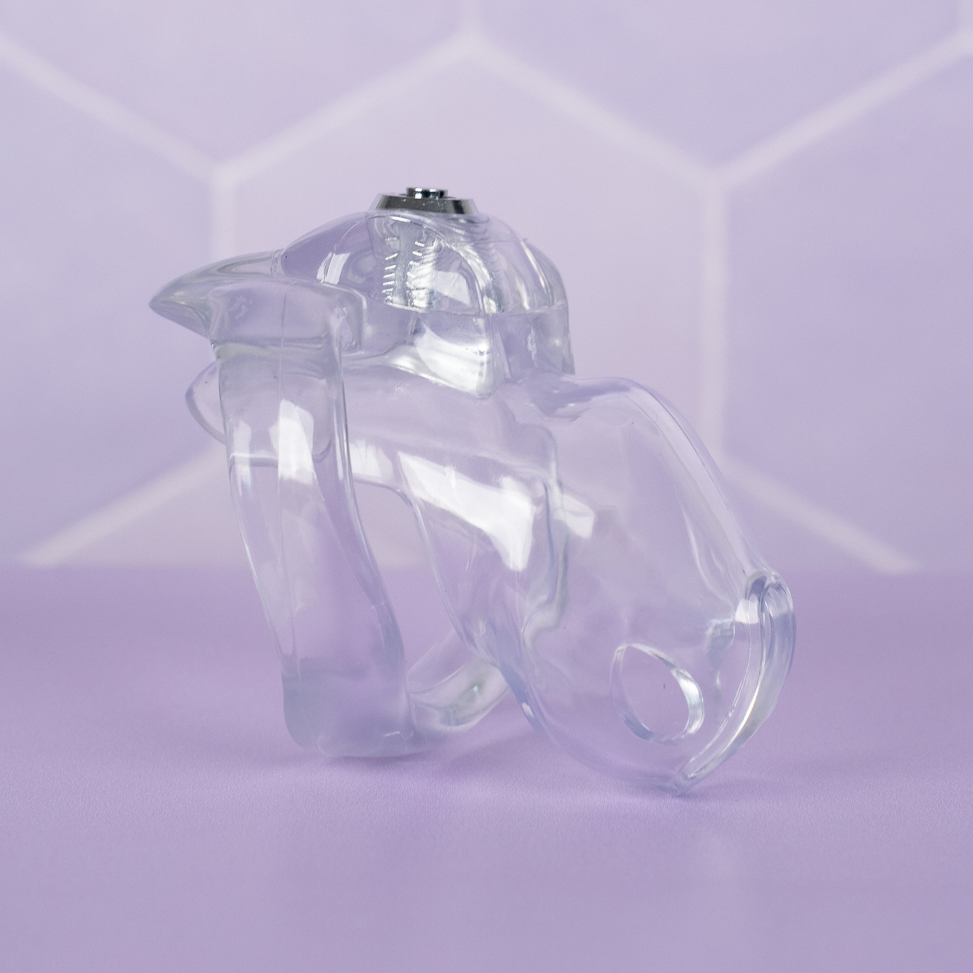 The HT V5 Nano Transparent chastity cage is shown here fully assembled, you can see the press lock is pushed in.