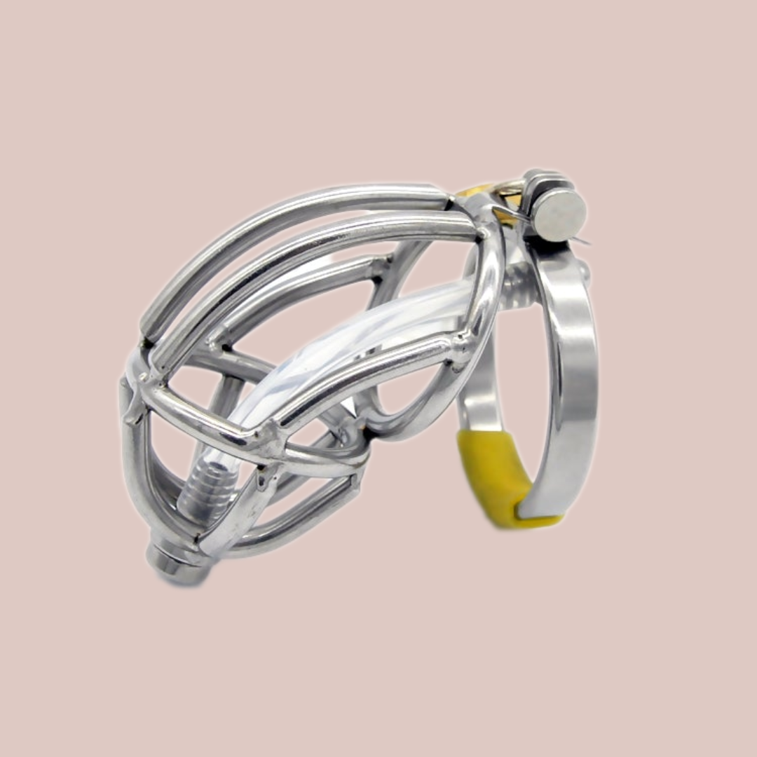A metal penis cage made from stainless steel, this is an open bar work design, with lines of steel meeting up to a a rounded open metal work head design. This cage has a hinge which allows the cage to move and an integral lock that fixes thecae to the base ring. There is also a urethral tube that can be removed.
