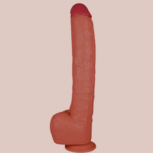 A view of the 32cm Dildo, you can see the pink head, veining to the body and shaped ball sacks. It has a sucker base.