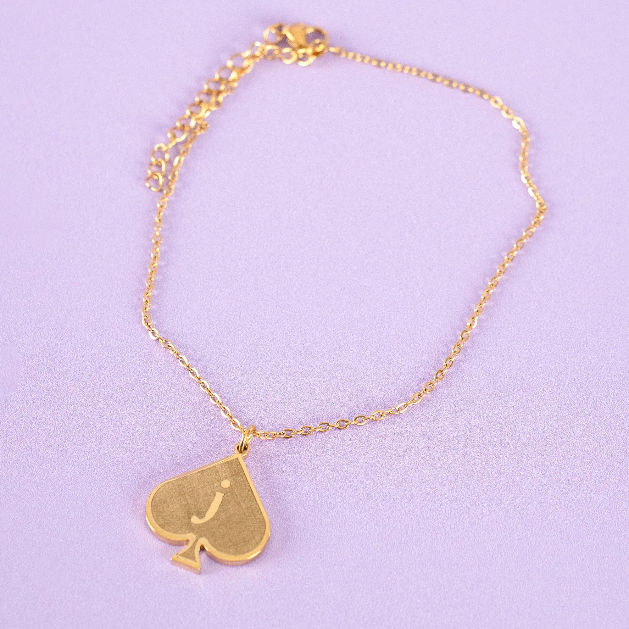 An image of the Jack of Spades bracelet or anklet, you can see the gold spade shaped pendant 