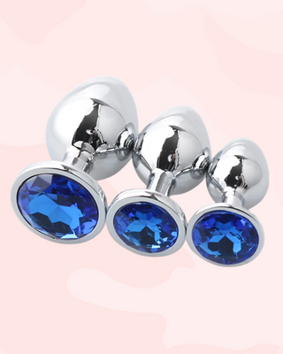 Three metallic anal plugs in small, medium and large, with royal blue gemstones
