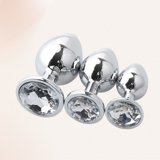 The Jewelled butt plug with clear base shown in the small, medium and large from the set.