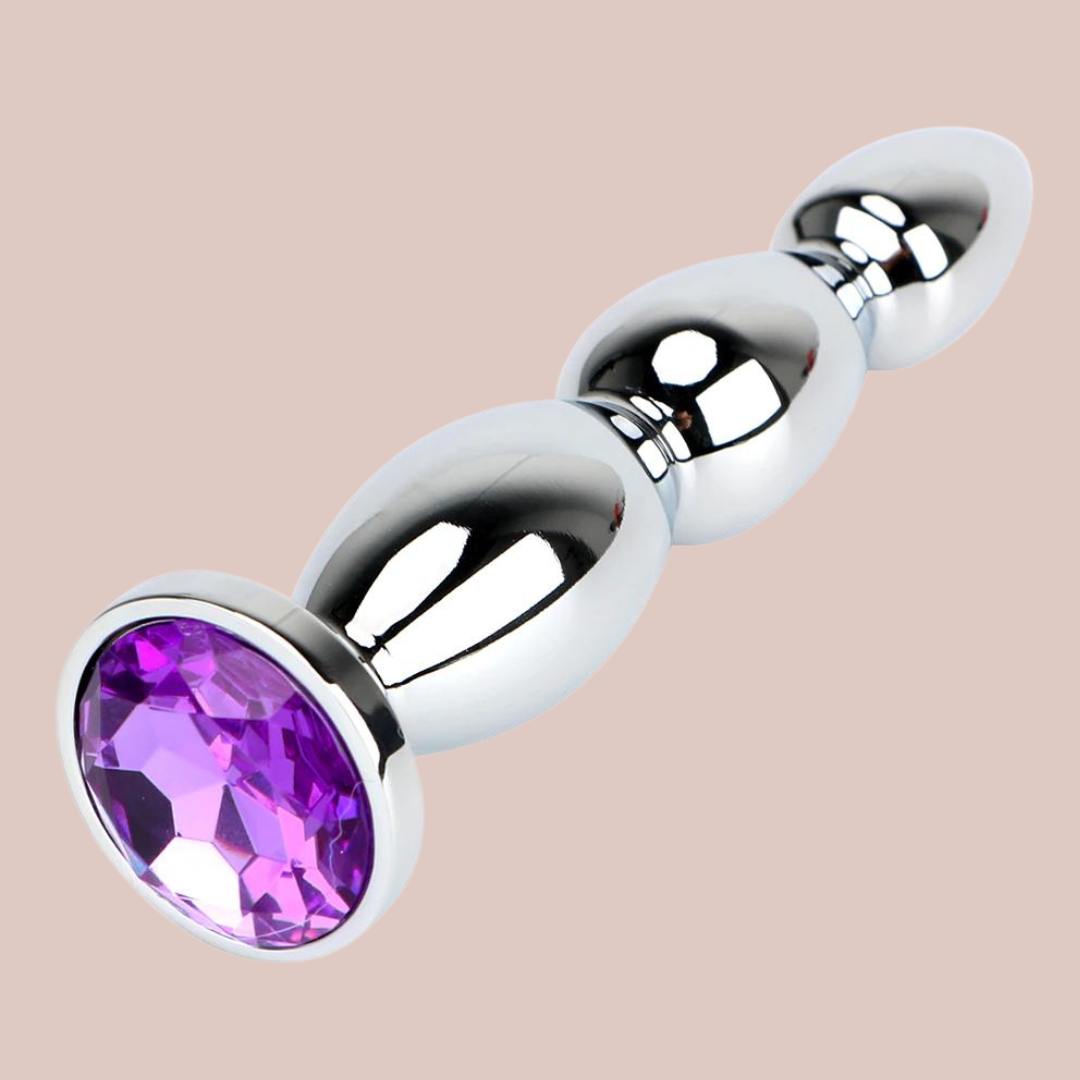 The purple  jewelled long length dilator from House Of Chastity