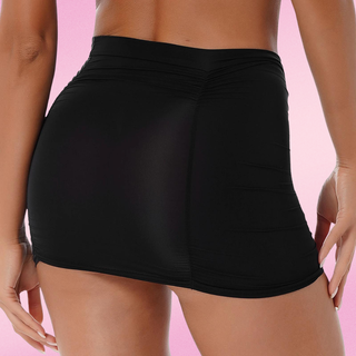 Black skirt worn by a person on a pink background