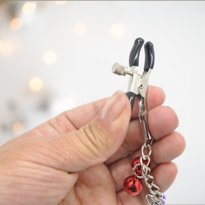 A close up of the tighten able clip on the Nipple Clamps With Bells from House Of Chastity.
