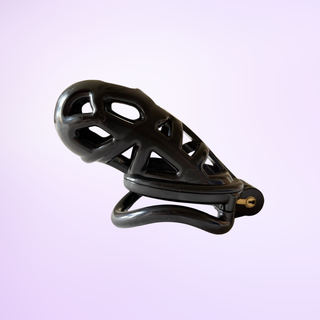 The chastity cage is sitting on its angled base ring, it is shown on a purple background.