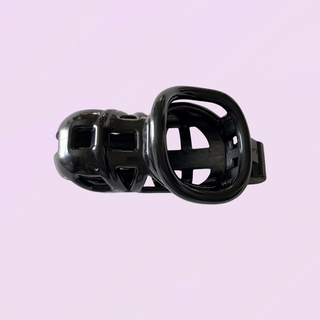 The underside of the chastity cage, the view inside the cage and base ring can be seen.